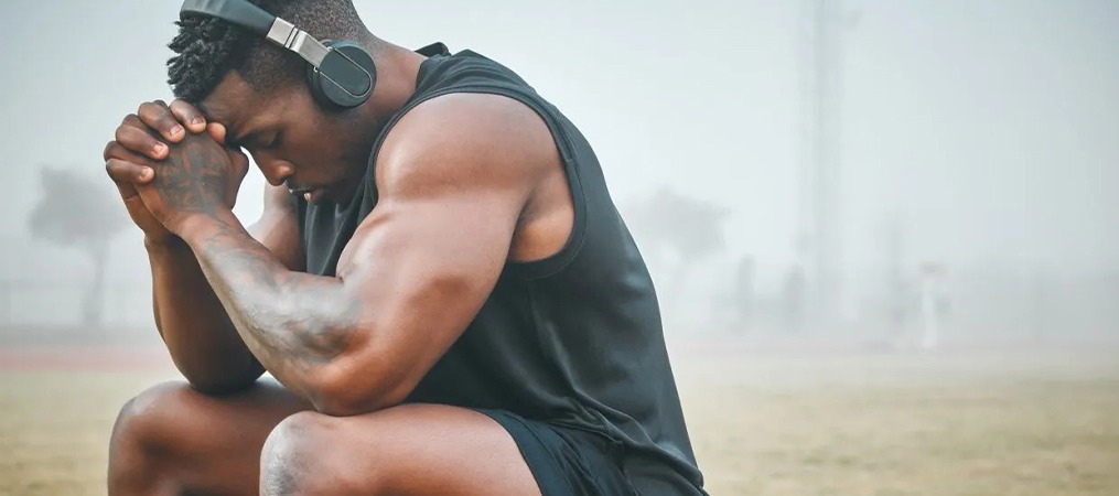 Athlete facing mental health struggles and performance pressure.